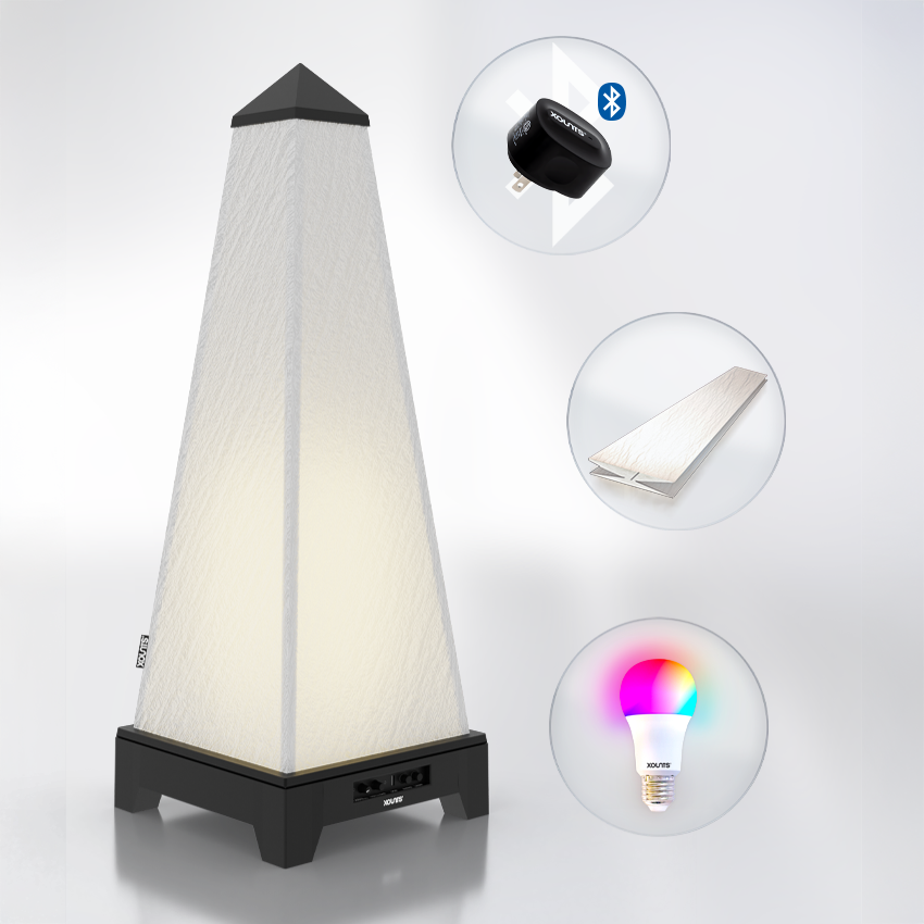 XOUNTS Starterkit with black base, showcasing the included accessories: Pure Glow Style cover for a sleek, modern look, energy-efficient LED bulb for ambient lighting, and the Bluetooth module for wireless music streaming. This all-in-one sound and lighting system is perfect for enhancing any room with both high-quality sound and customizable lighting options.